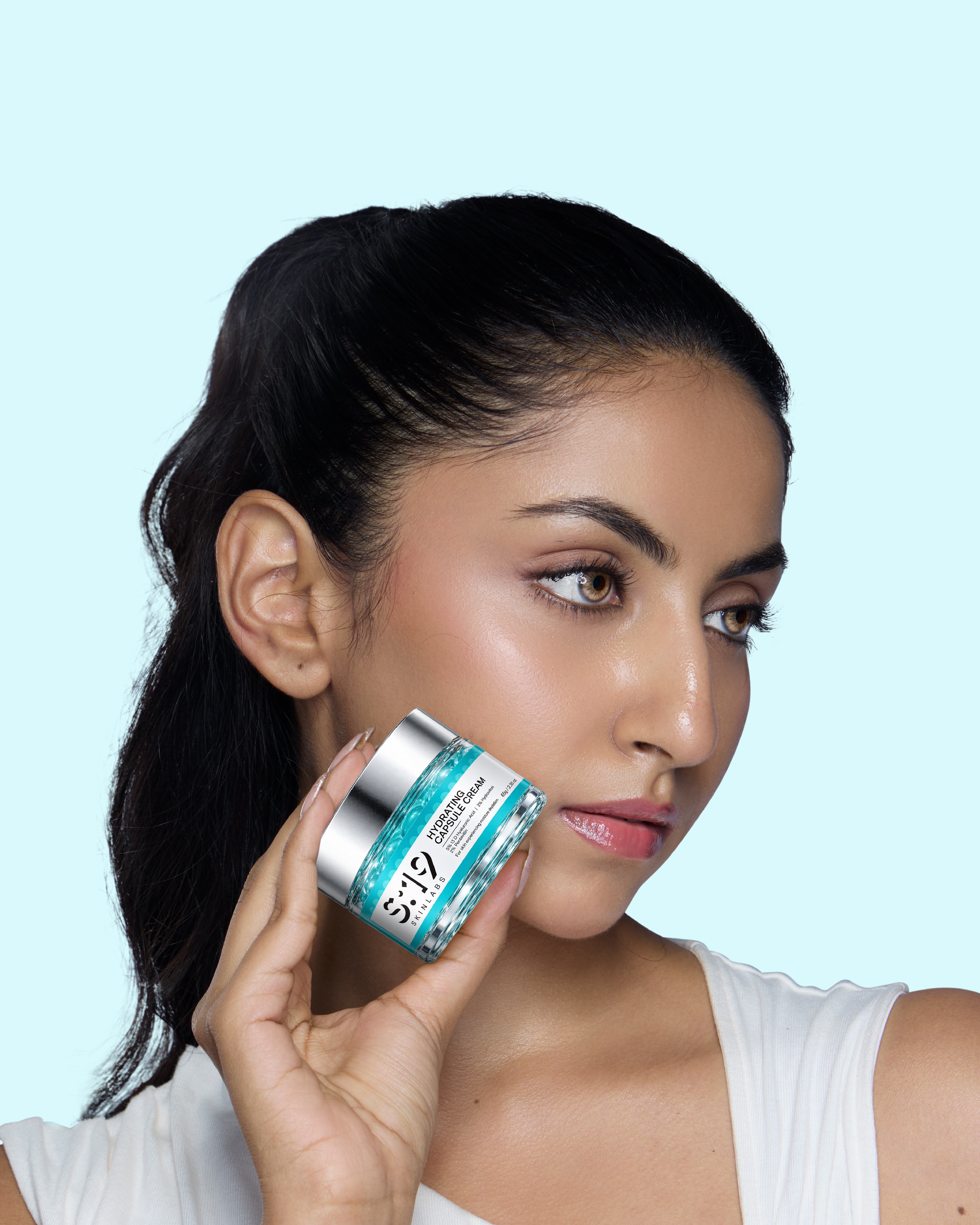 Model holding S19 Hydrating Capsule Cream for dehydrated skin
