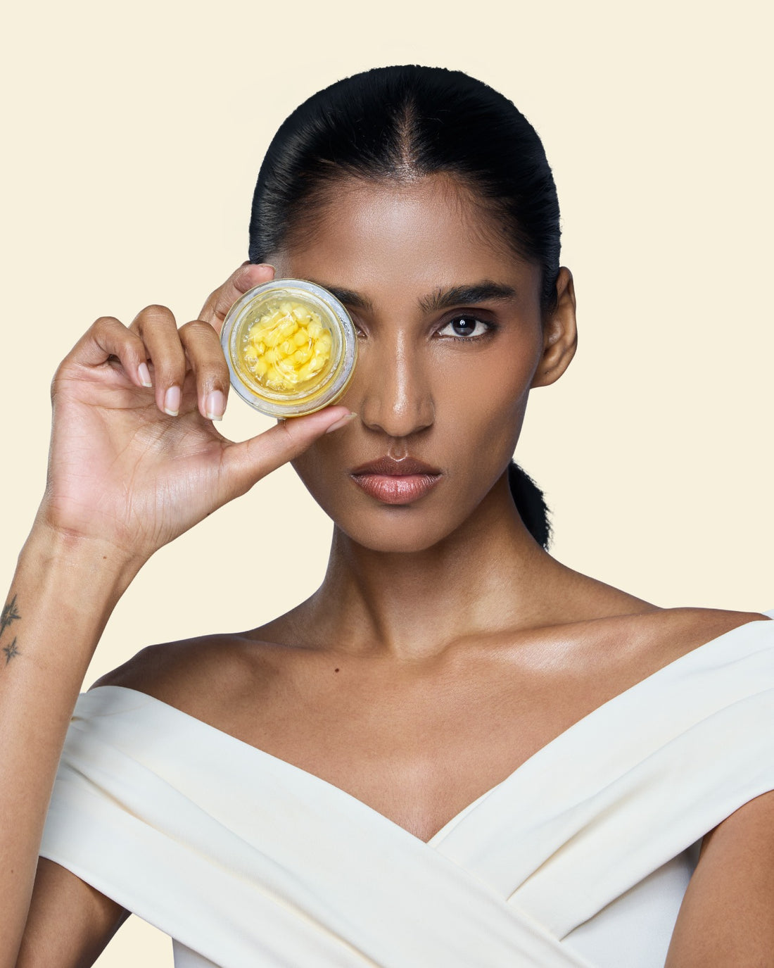 Model holding S19 Sebum Control Capsule Cream for oily skin